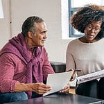 A shot of a man and a woman having business.