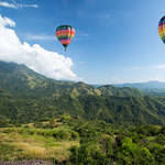 Hot air balloon over mountain landscape