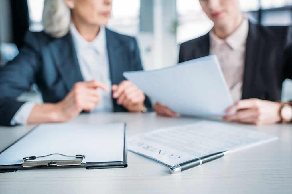 Close-up of business women having discussion.