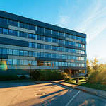 Corporate business office and the street on the background sun light.